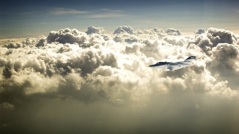 Airplane flying above clouds