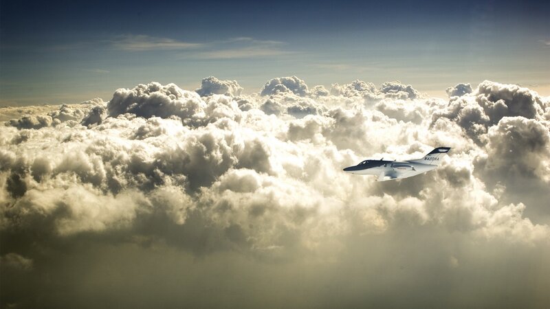 Airplane flying above clouds