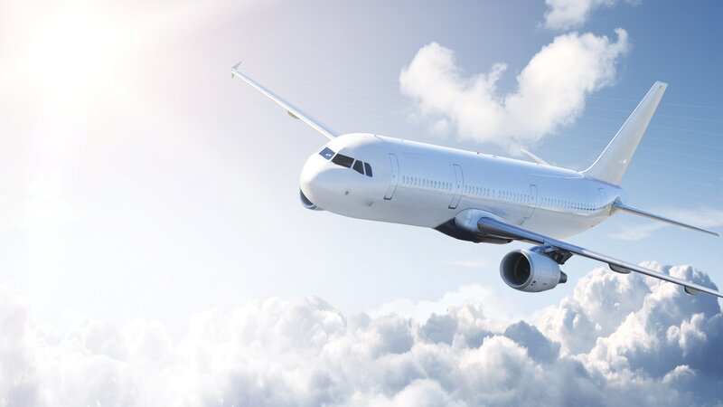 airplane flying above clouds