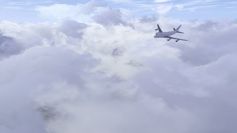 Airplane flying above clouds