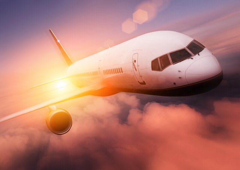 Airplane flying above clouds