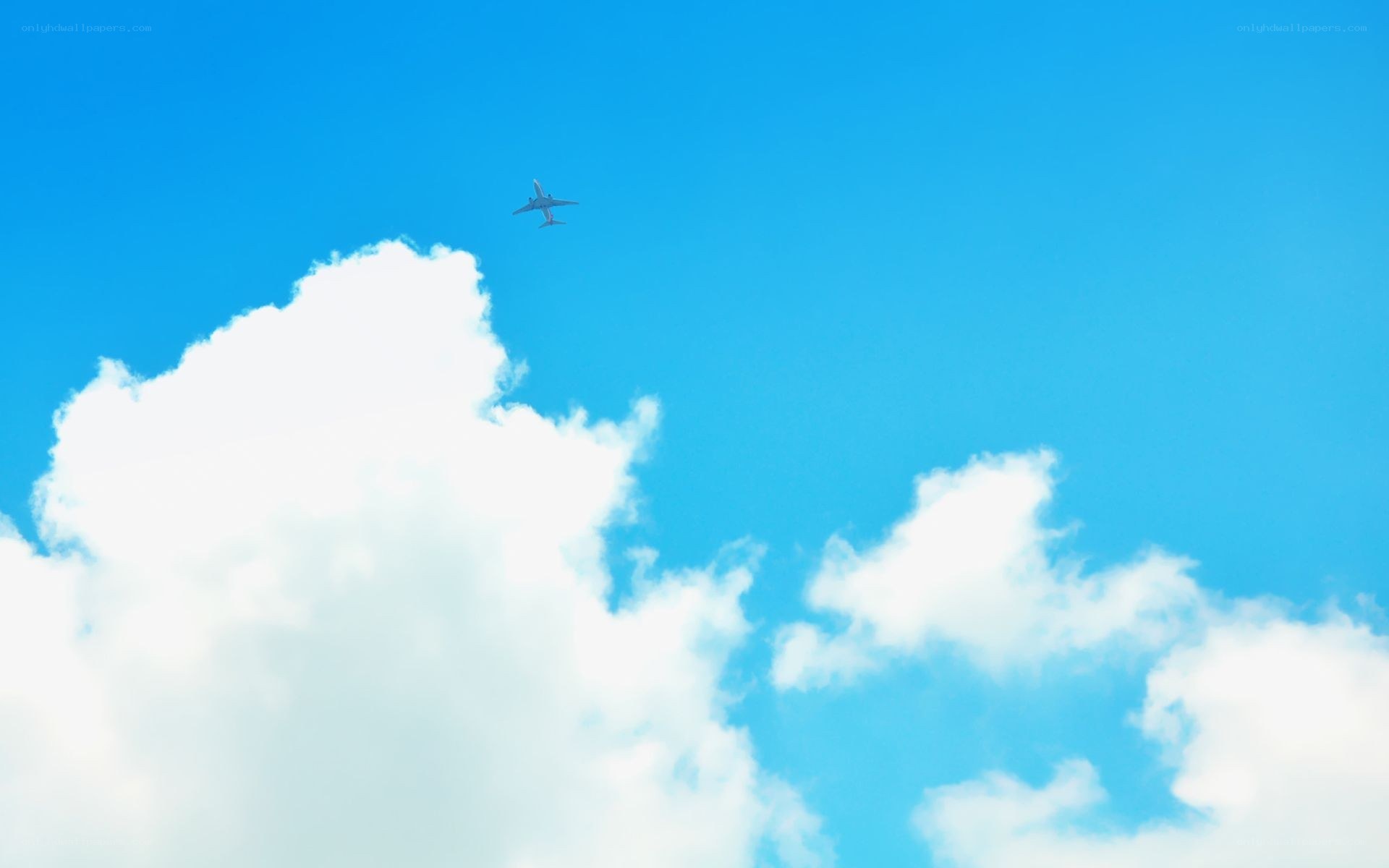 Airplane flying above clouds