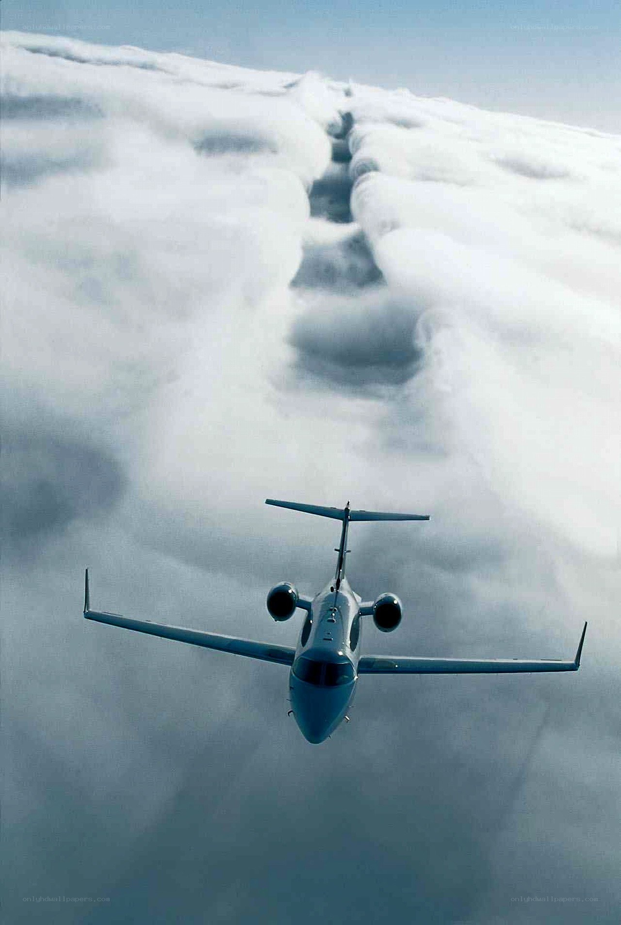 airplane flying above clouds
