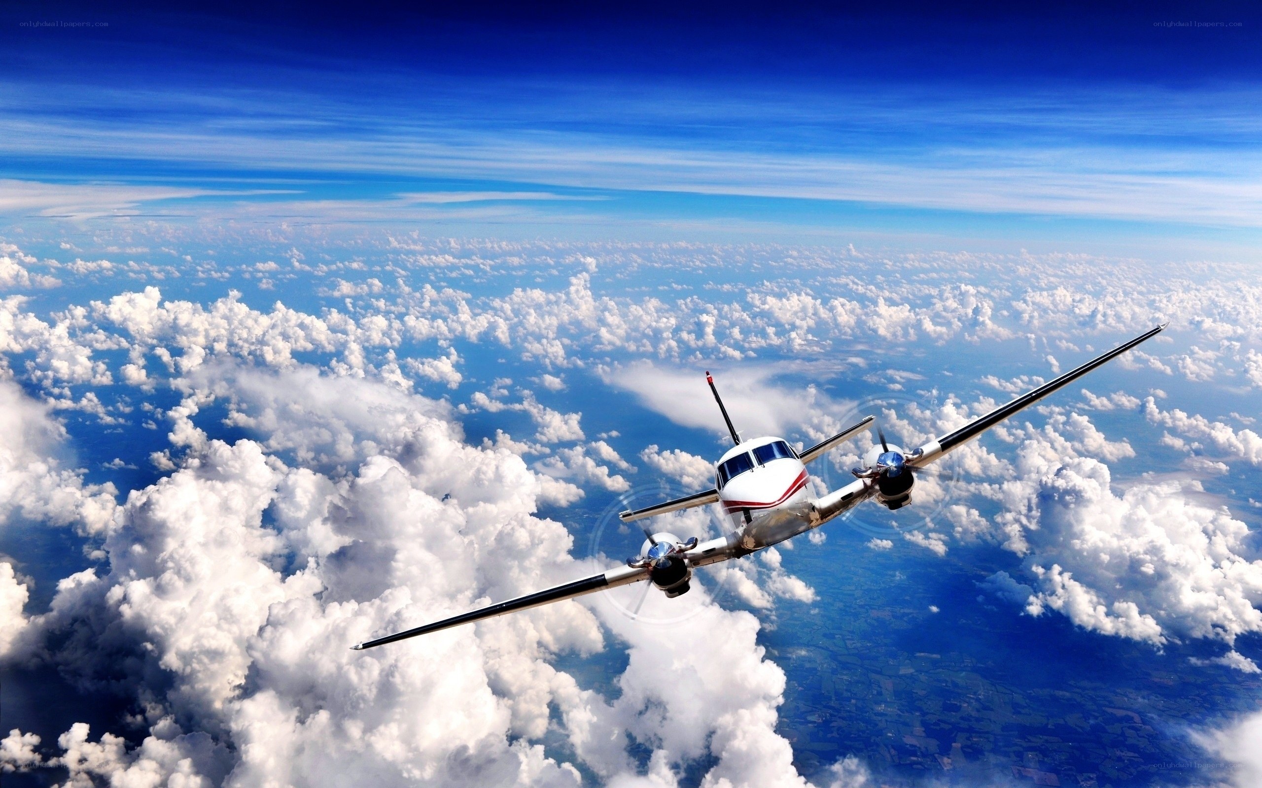 Airplane flying above clouds