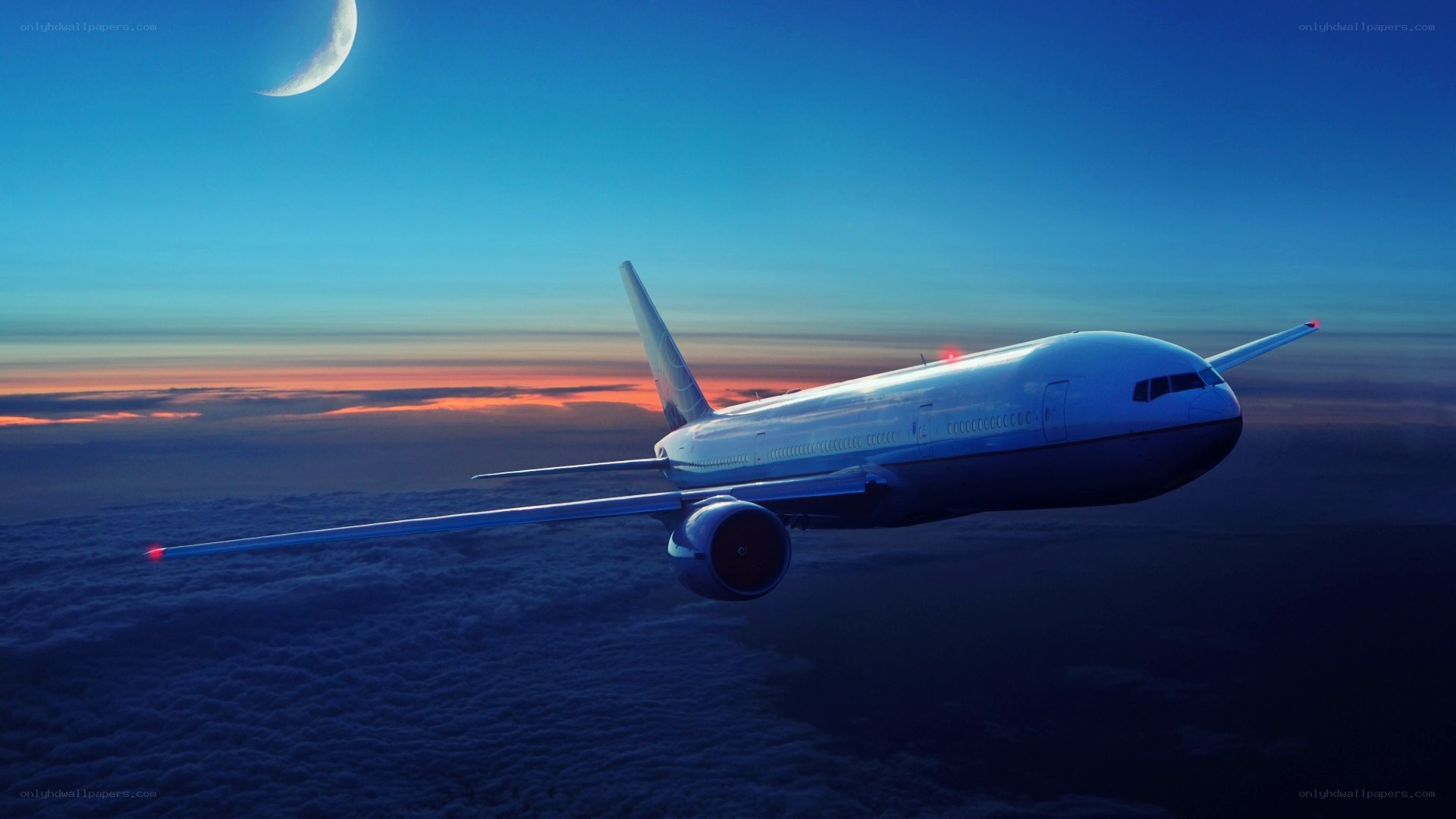 Airplane flying above clouds at dusk