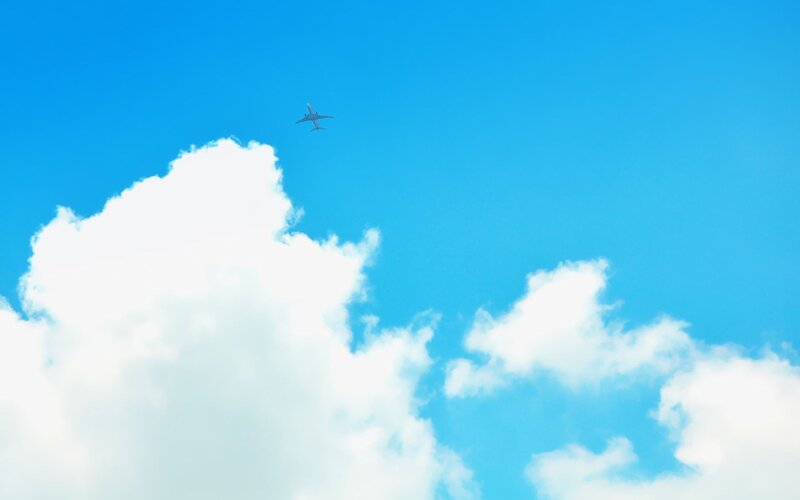 Airplane Flying Above Clouds — Blue, Serene, Afternoon, Photograph, Sky, White