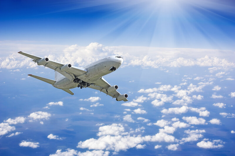 Airplane Flying Above Clouds — Blue, Serene, Afternoon