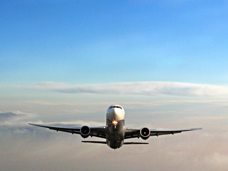 Airplane Flying Above Clouds — Blue, Serene, Morning