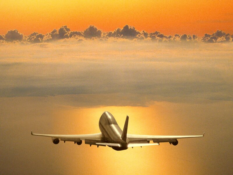 Airplane Flying Above Clouds — Orange, Serene