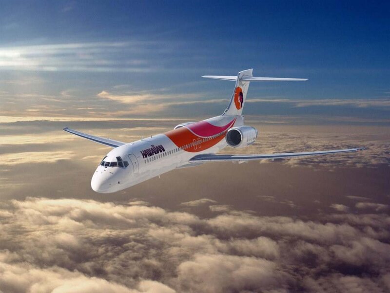 Airplane Flying Above Clouds — White, Serene, Afternoon