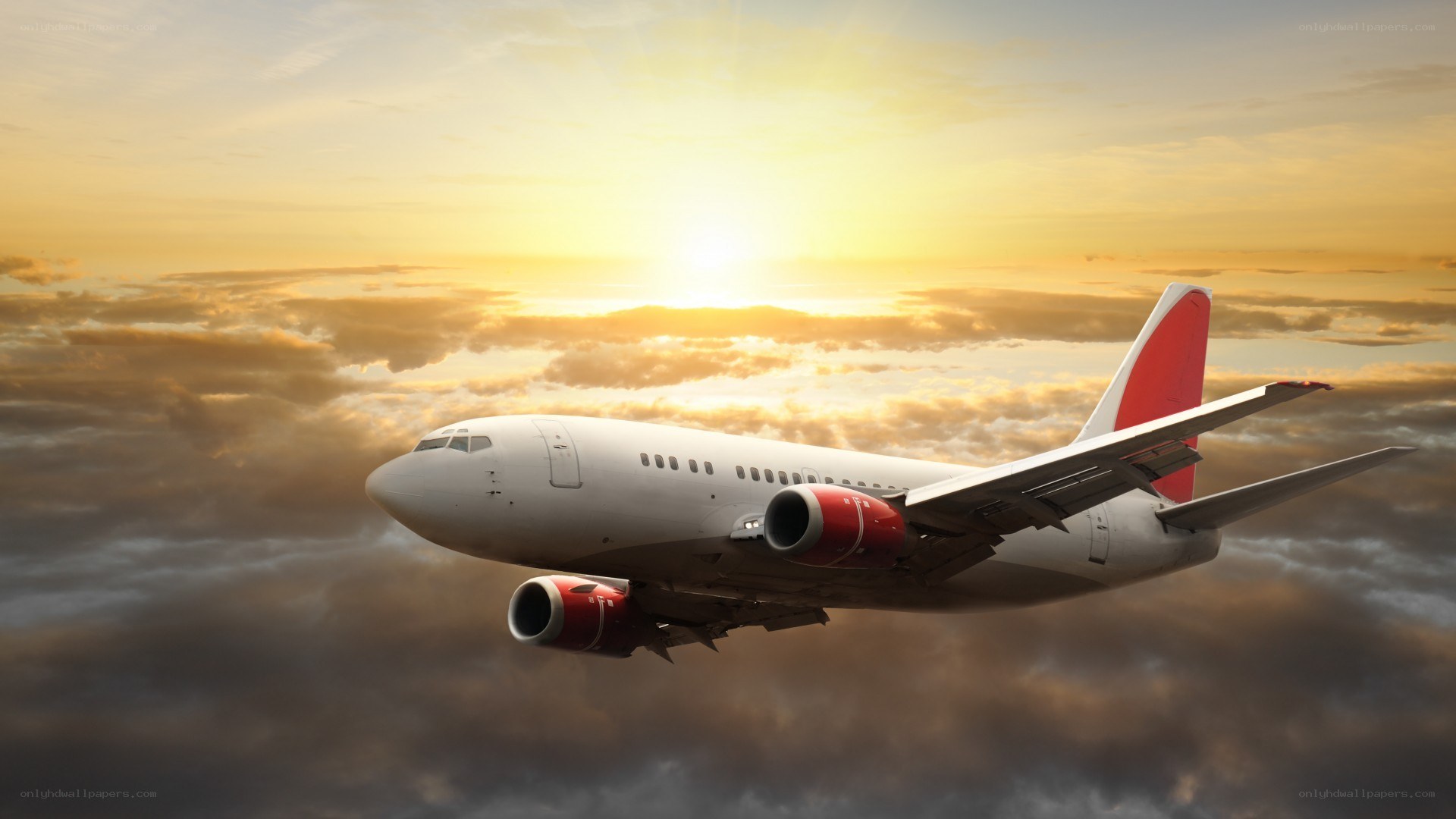 airplane flying at sunset