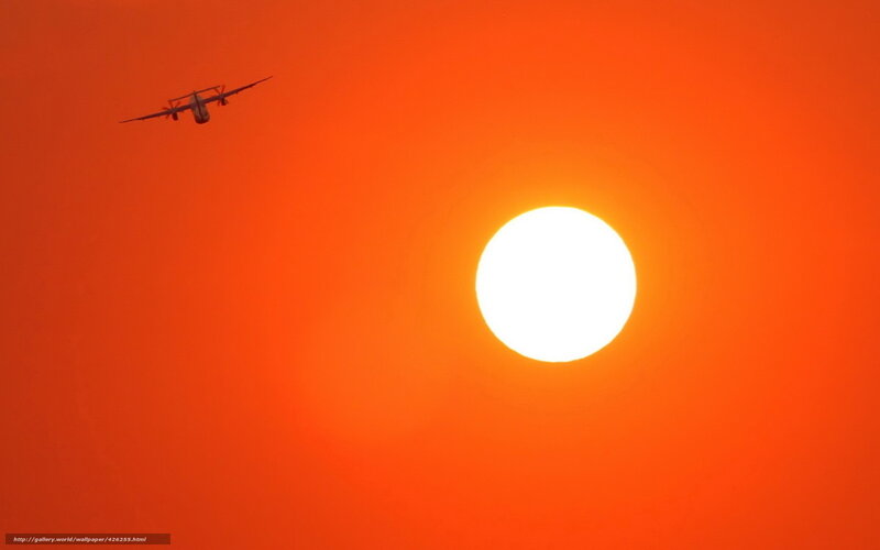 Airplane Flying at Sunset — Orange, Dramatic, Photograph