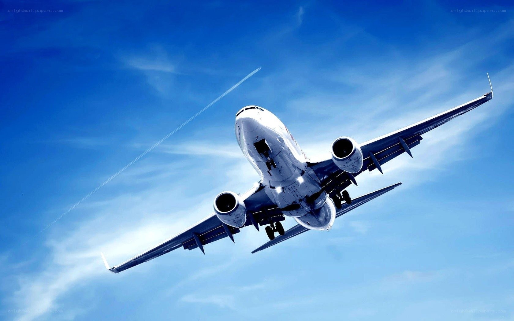 airplane flying in blue sky