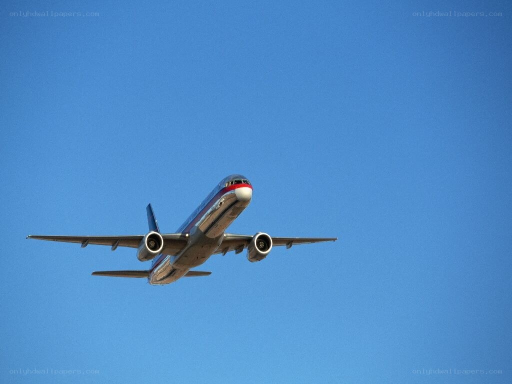 airplane flying in blue sky