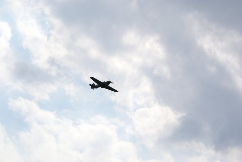 airplane flying in cloudy sky