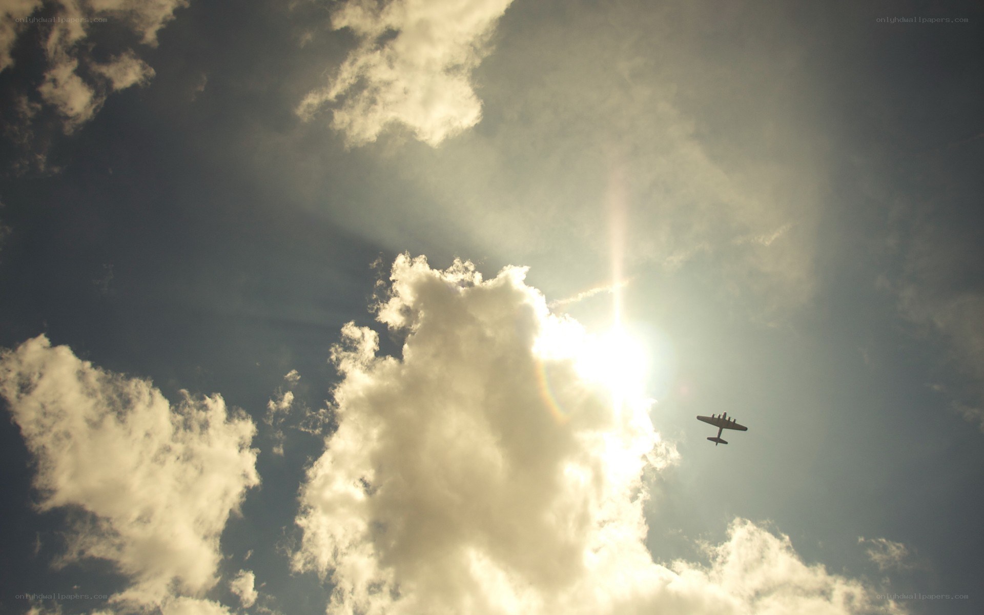 Airplane flying in cloudy sky