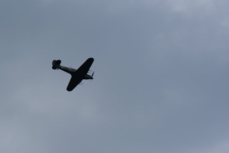 airplane flying in cloudy sky
