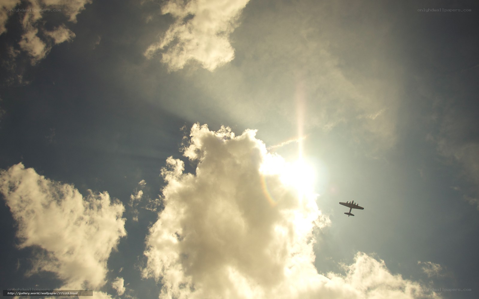 Airplane flying in cloudy sky