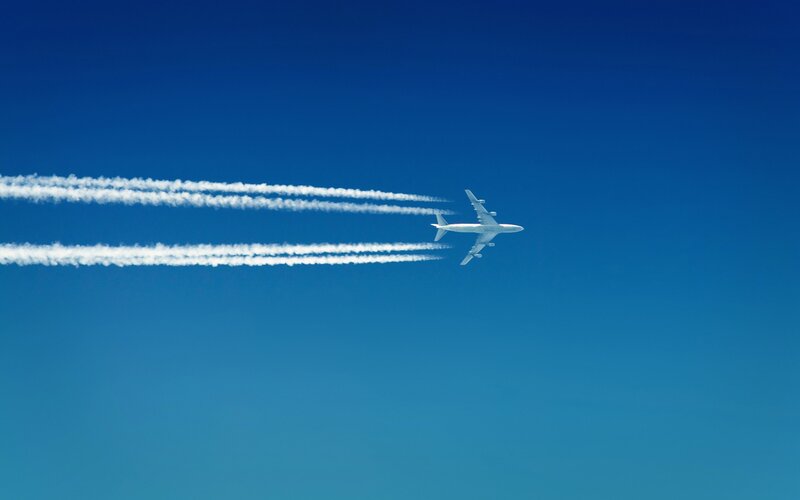 Airplane Flying in Sky — Blue, Serene, Afternoon, Photograph, Contrails