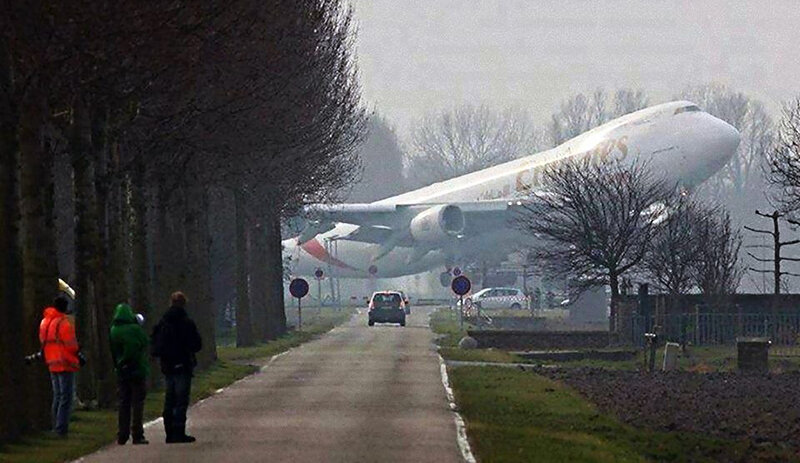 Airplane Flying Low — White