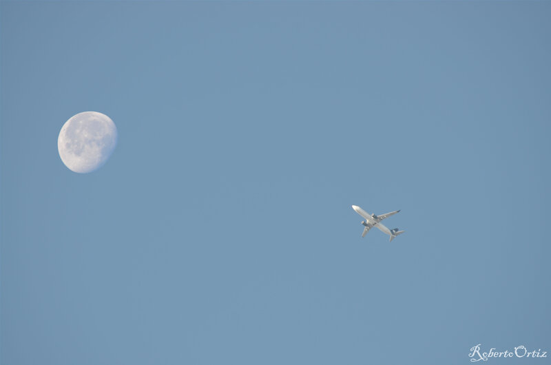 Airplane Flying Near Moon — Blue, Serene