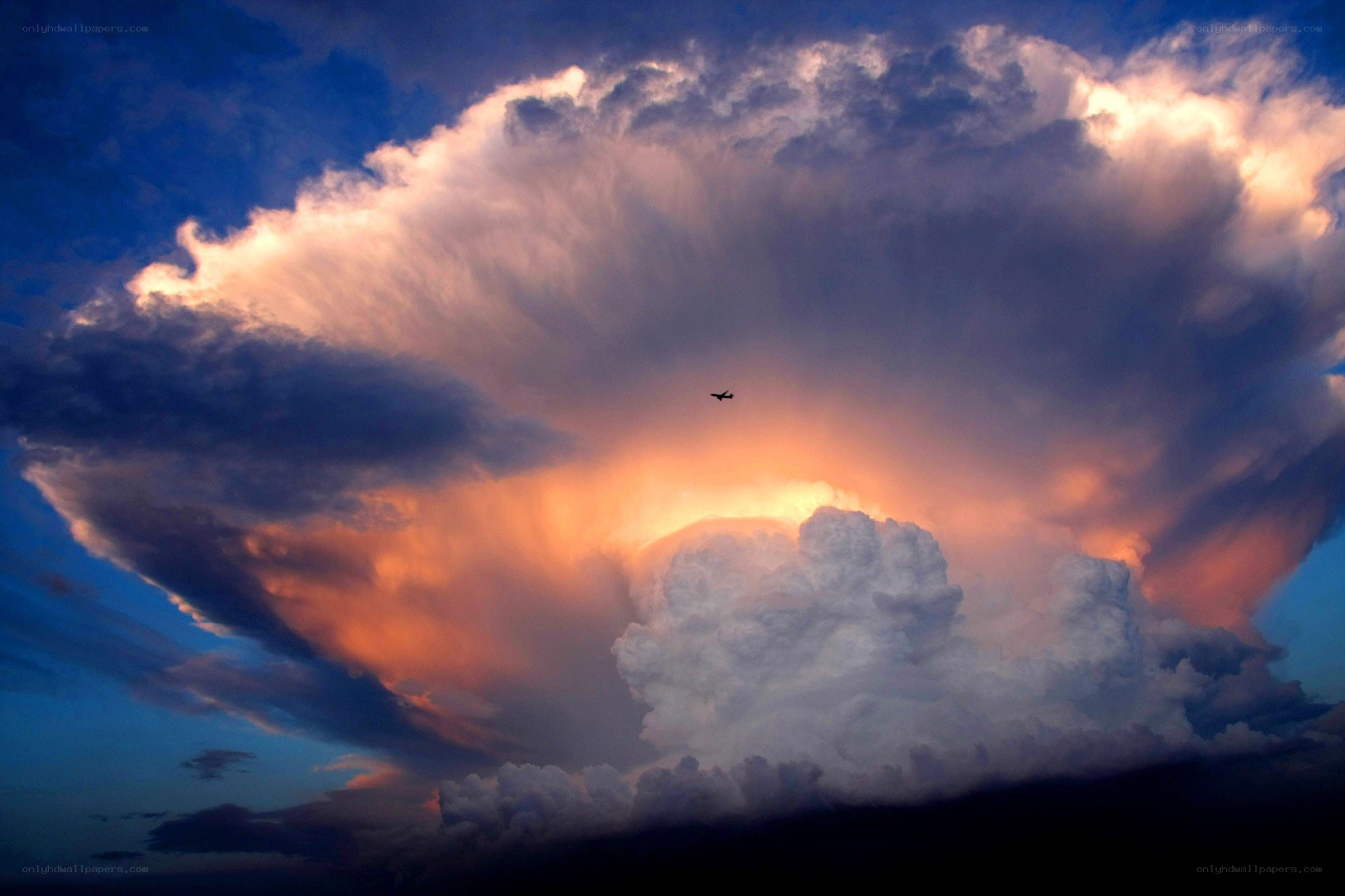 Airplane flying near storm cloud