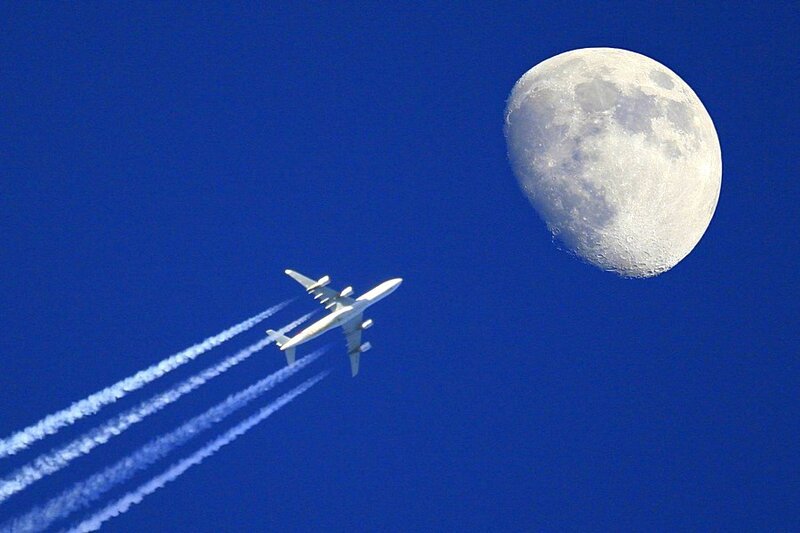 Airplane flying near the moon