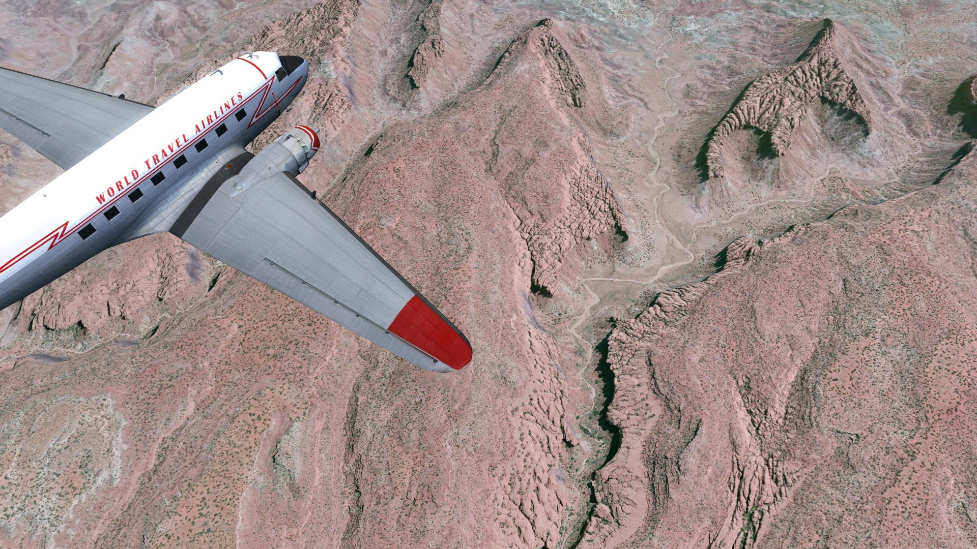 Airplane flying over canyon