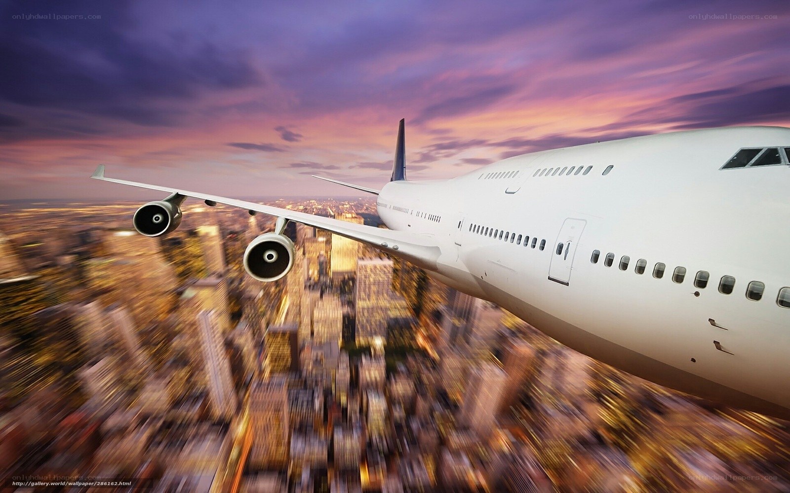 Airplane flying over city