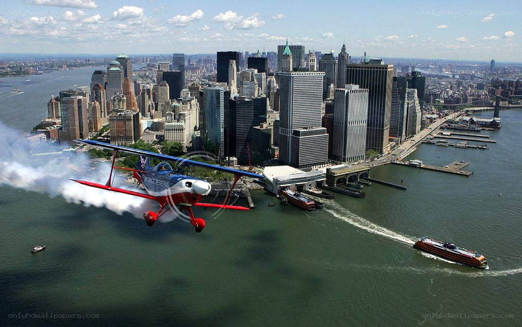 airplane flying over city