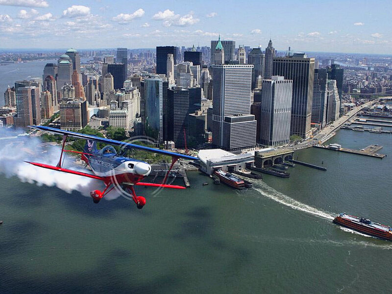 airplane flying over city
