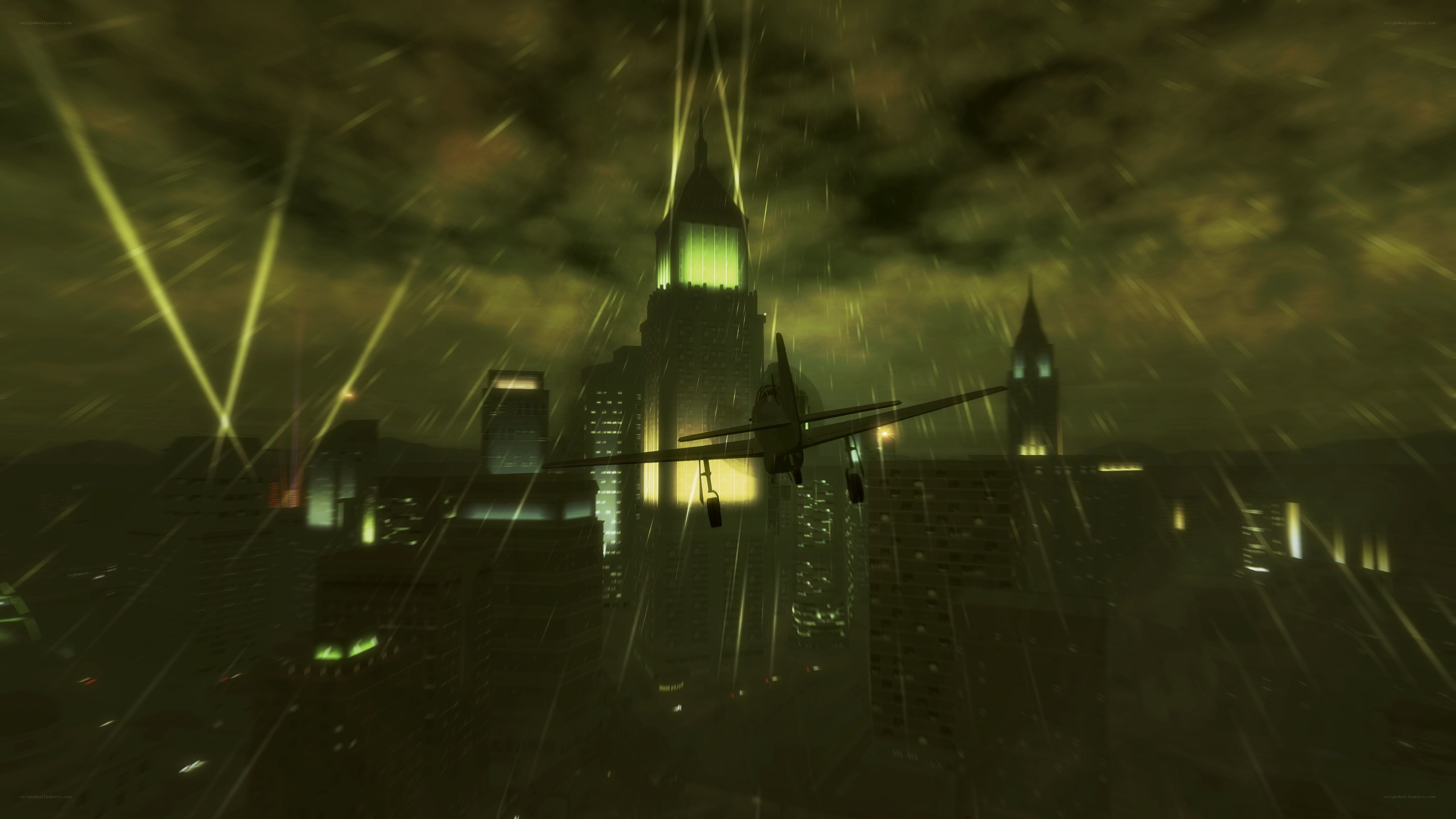airplane flying over city at night