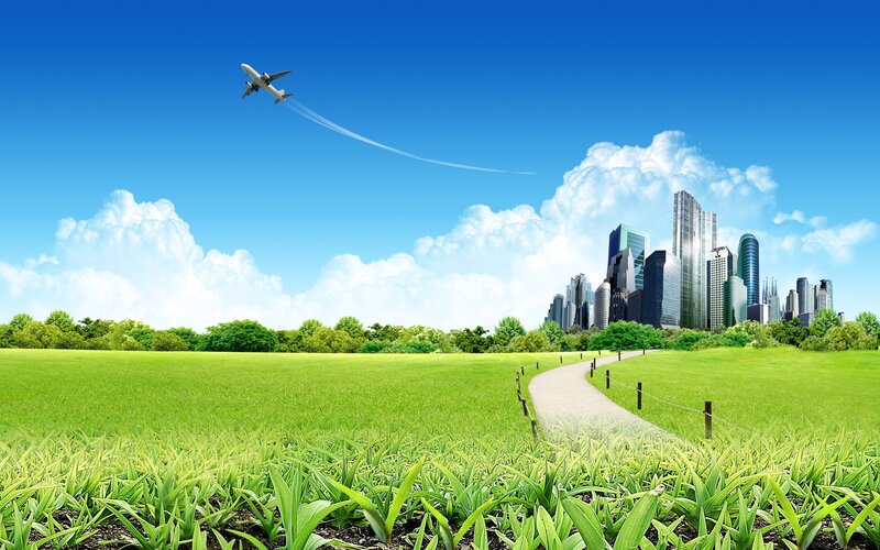 Airplane Flying over City — Green