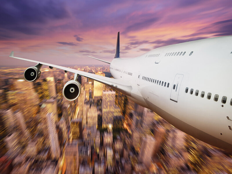Airplane Flying over City — Purple