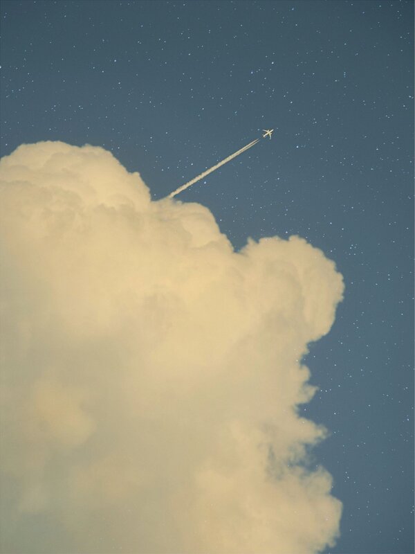 Airplane Flying over Cloud