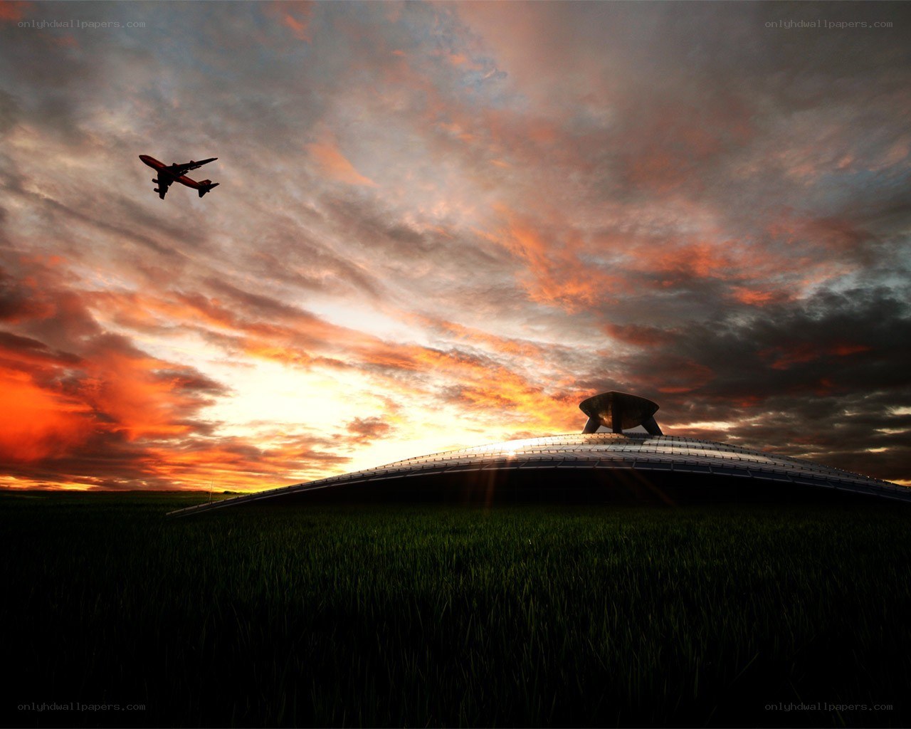 Airplane flying over dome at sunset