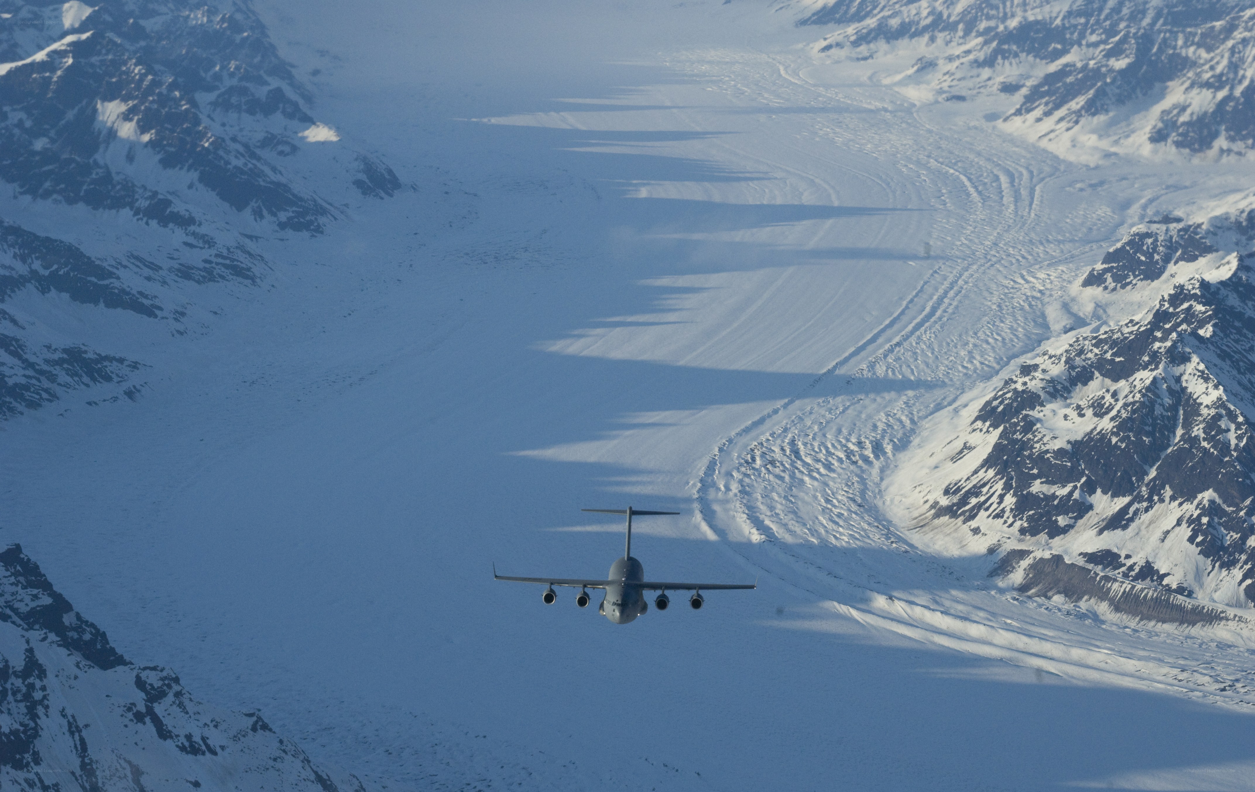 Airplane flying over glacier