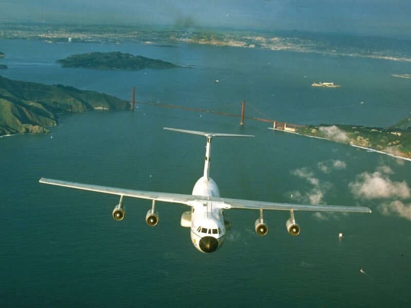Airplane flying over Golden Gate Bridge
