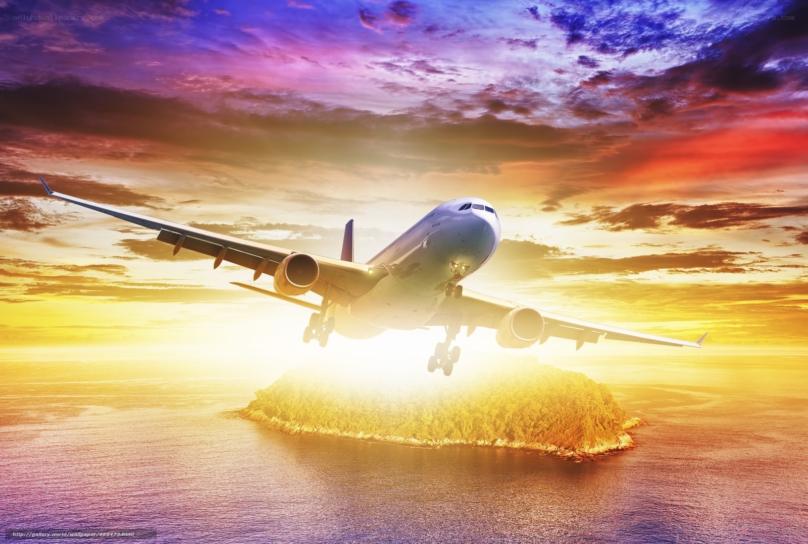 Airplane flying over island at sunset