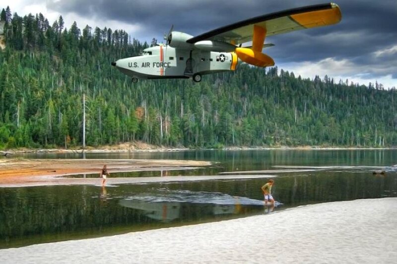 Airplane flying over lake