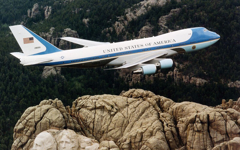 Airplane Flying over Mountain
