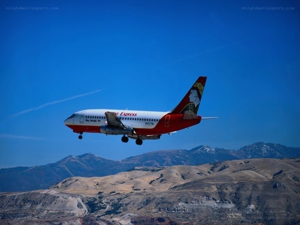 Airplane flying over mountains