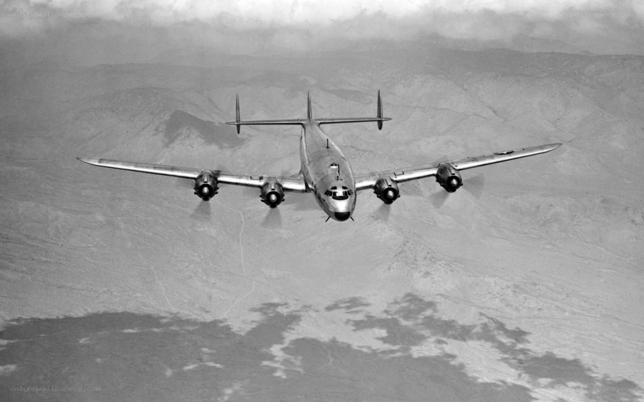 airplane flying over mountains