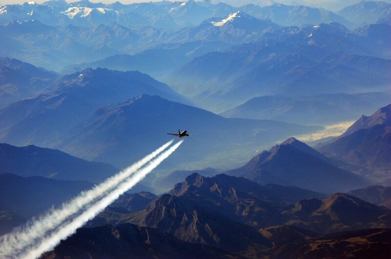 Airplane Flying over Mountains — Blue