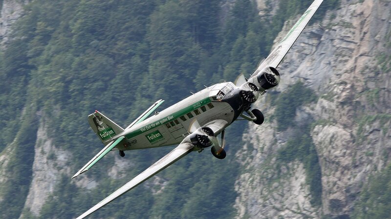 Airplane Flying over Mountains — Green, Dramatic