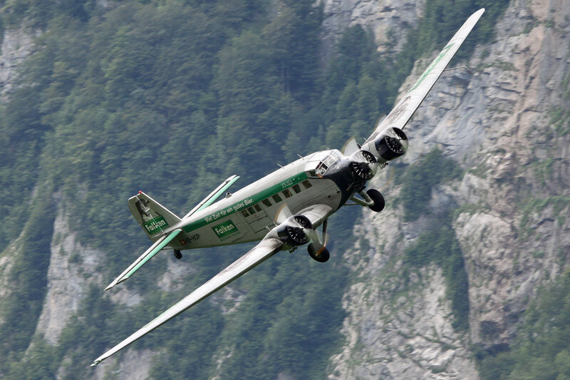 Airplane Flying over Mountains — Green