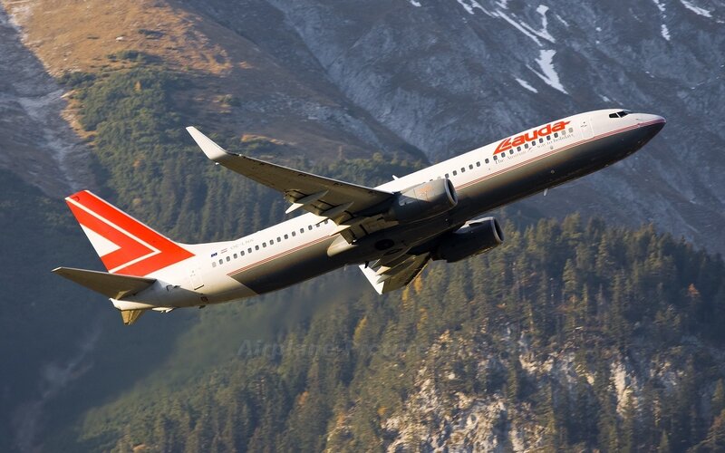 Airplane Flying over Mountains — White, Dramatic, Afternoon