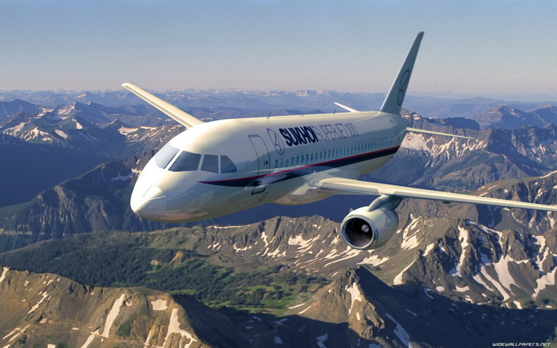 Airplane Flying over Mountains — White
