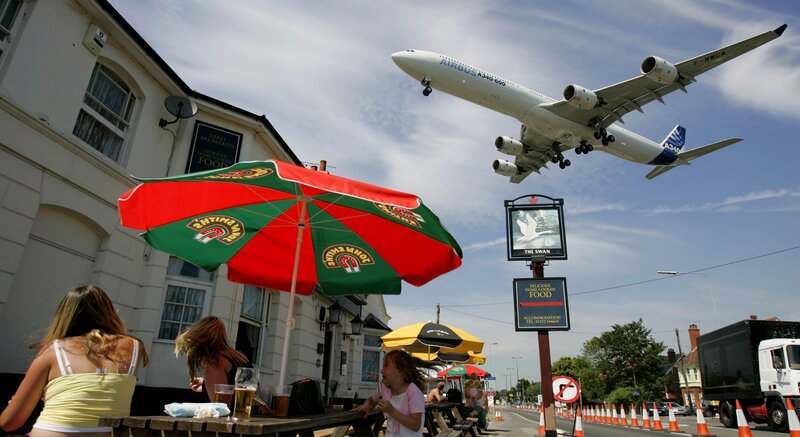 Airplane Flying over Pub