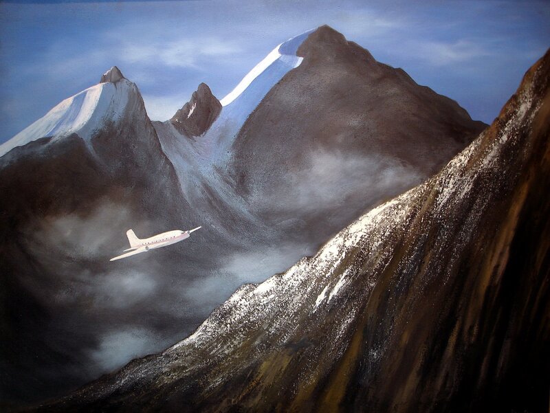 Airplane flying over snowy mountains